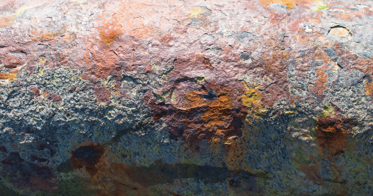 A zoomed in photo of pipeline corrosion highlighting the need for corrosion protection and closed interval surveys to ensure pipeline integrity. These are services EARTHRES provides.